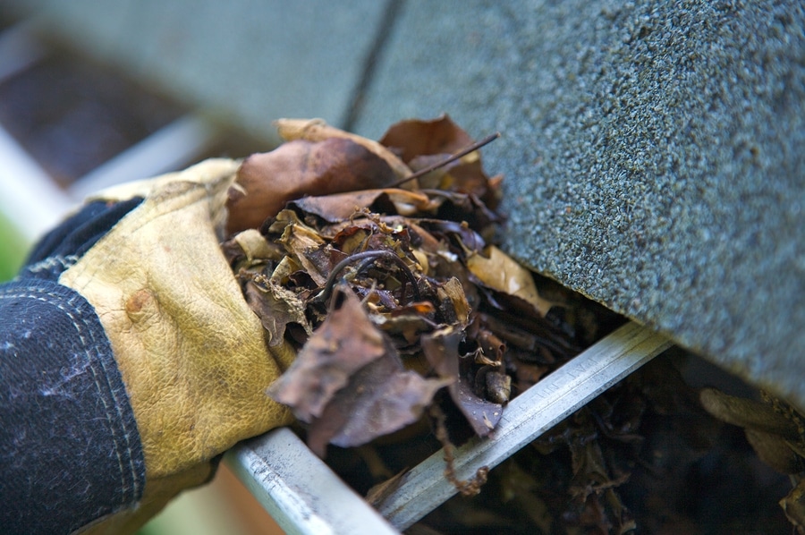 Is it safe to clean gutters on my own?