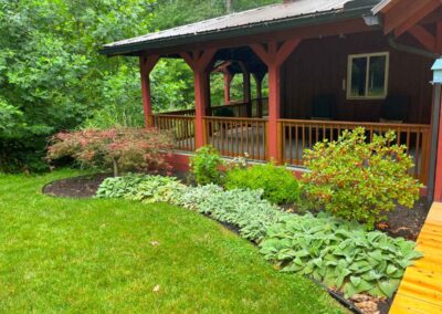 A landscaped yard and flowerbed outside a home in Unionville