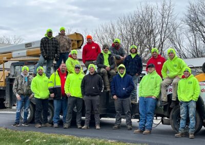 The Anthony’s Lawn Care, Landscaping and Tree removal team stand by they trailer.
