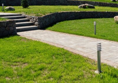 walkway and bush that is concrete pavement floor